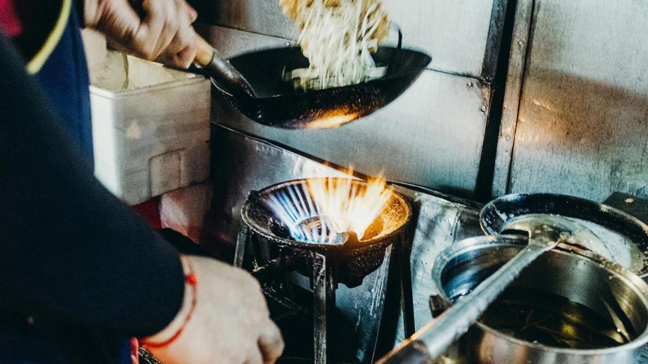 Muu Bangkok, Small Luxury Hotels Of The World Exterior photo A wok being used in a restaurant kitchen